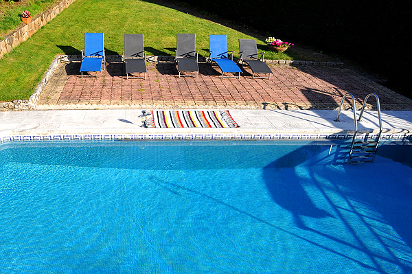 Private pool with lawn is just above the house